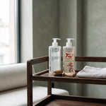 Magnesium and Tai massage oils 500 ml with a wooden massage roller on a trolley