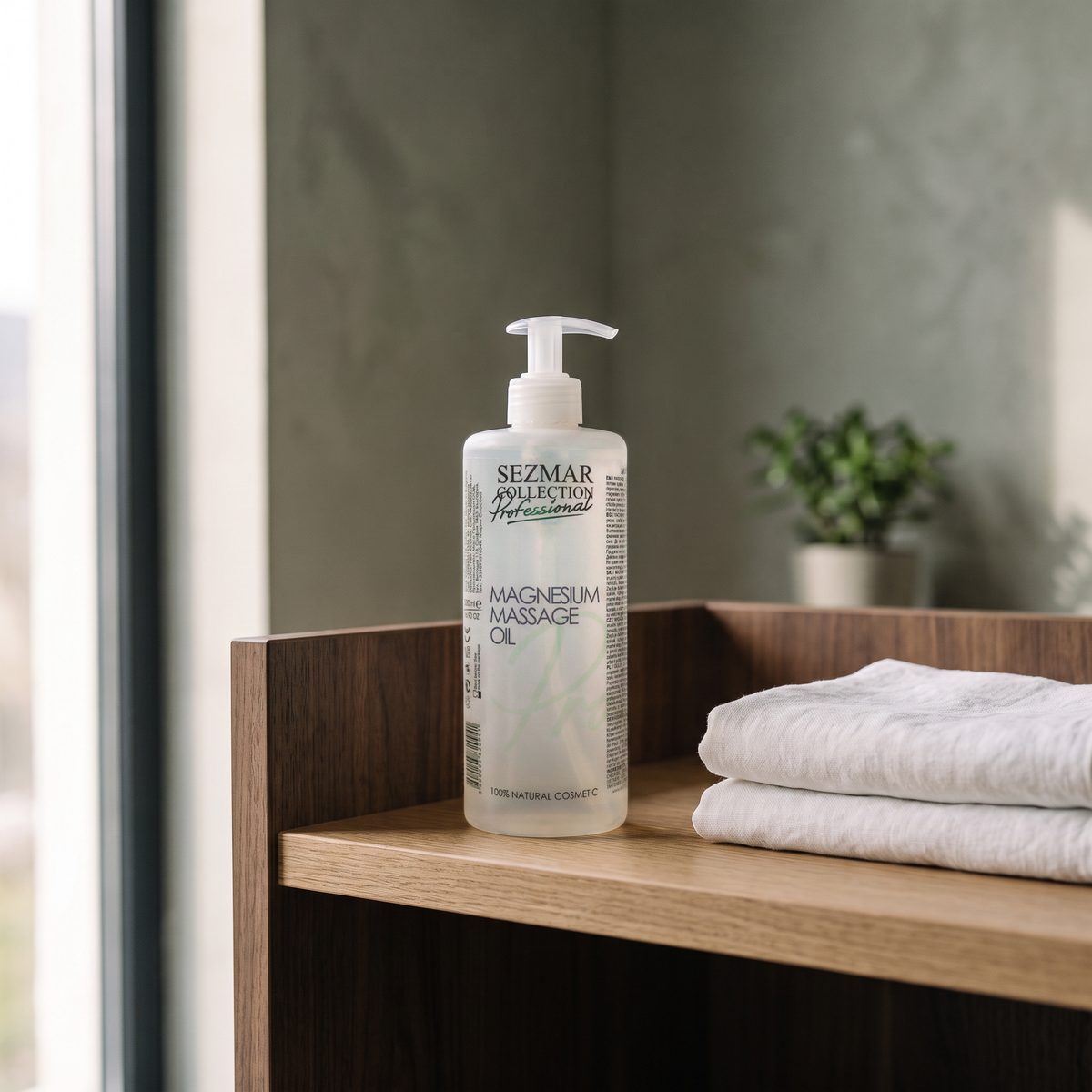 Magnesium Massage Oil 500 ml on a shelf in a treatment room